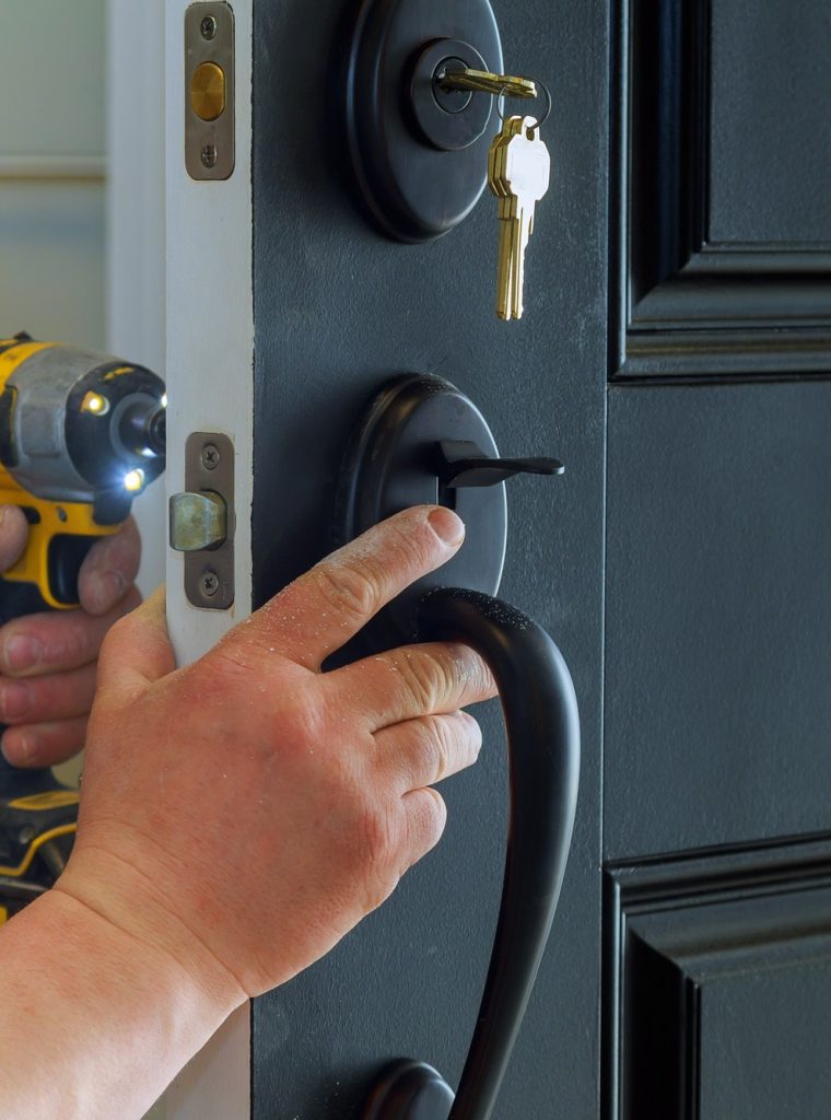 closeup-of-a-professional-locksmith-installing-a-new-lock-on-a-house-exterior-door-with-the-inside.jpg closeup-of-a-professional-locksmith-installing-a-new-lock-on-a-house-exterior-door-with-the-inside.jpg